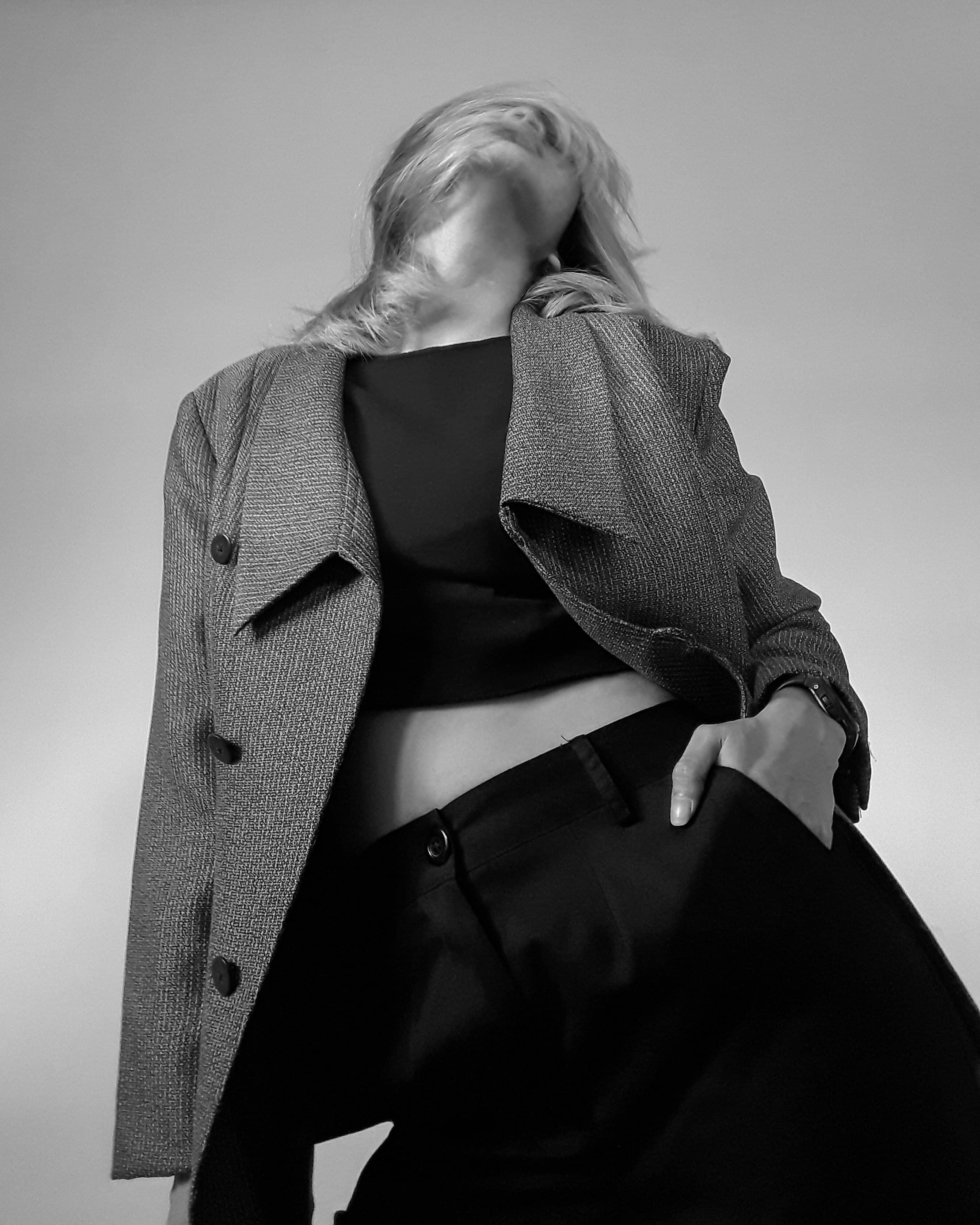 Sophisticated luxury editorial portrait with restrained, clean styling